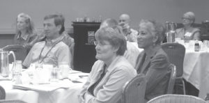 Photo of a group of people sitting and listening at The Uniform Bar Examination: Moving Forward meeting