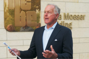 Patrick Dixon speaking in front of the NCBE building