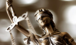 statue of lady justice holding scale