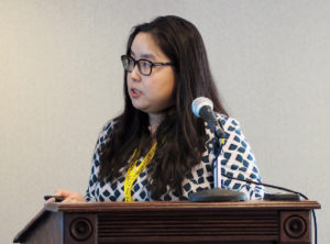 Mengyao Zhang, Ph.D. (NCBE) speaking at a podium