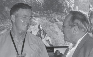 Photo of Alan Odgen (left) talking with Bob McMillan at the regional informational meeting for six states in the Northeast