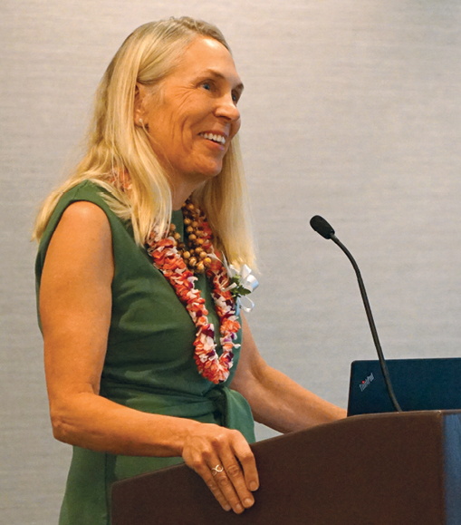 Judith Gundersen speaking at a podium