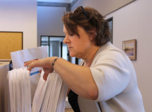 Photo of Ellen Embertson filing papers