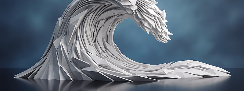 An ocean wave sculpture comprised of angular white chips sits on a dark blue tabletop. The background is a wall of mottled dark and light blues.
